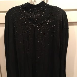 Woman sleeveless sweater with long sleeve sweater